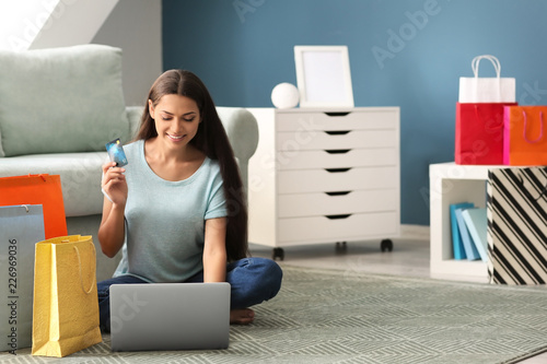 Young Woman Online Shopping...