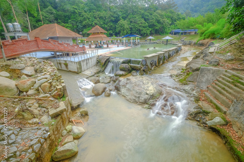 Continuous water flowing in the river of Ulu Bendul, Malaysia photo