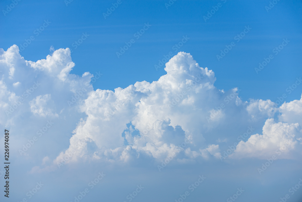 Rain clouds forming with blue sky background