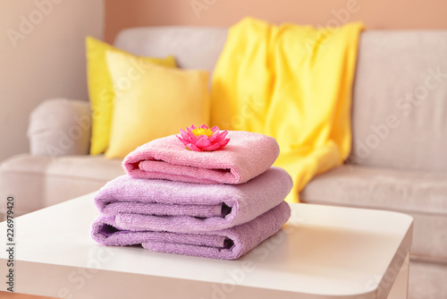 Stack of clean towels on table