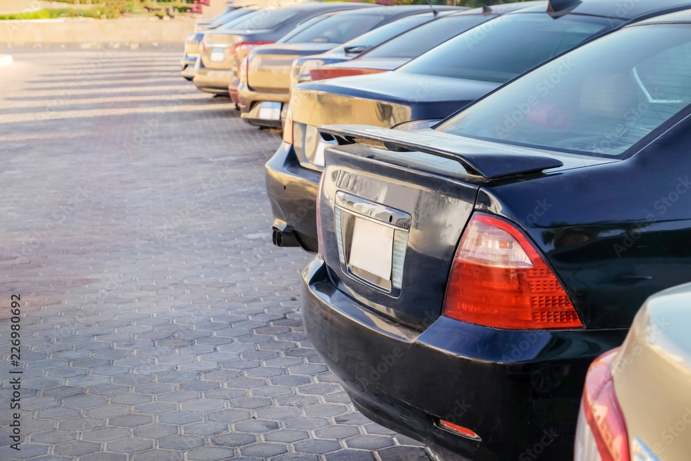 Fototapeta premium Row of parked cars on city street