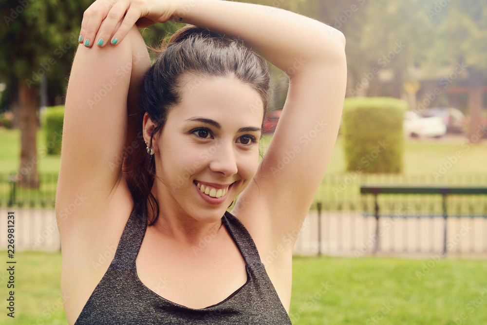 Portrair of young beautiful woman doing exercise at park Portrair of young beautiful woman doing exercise at park