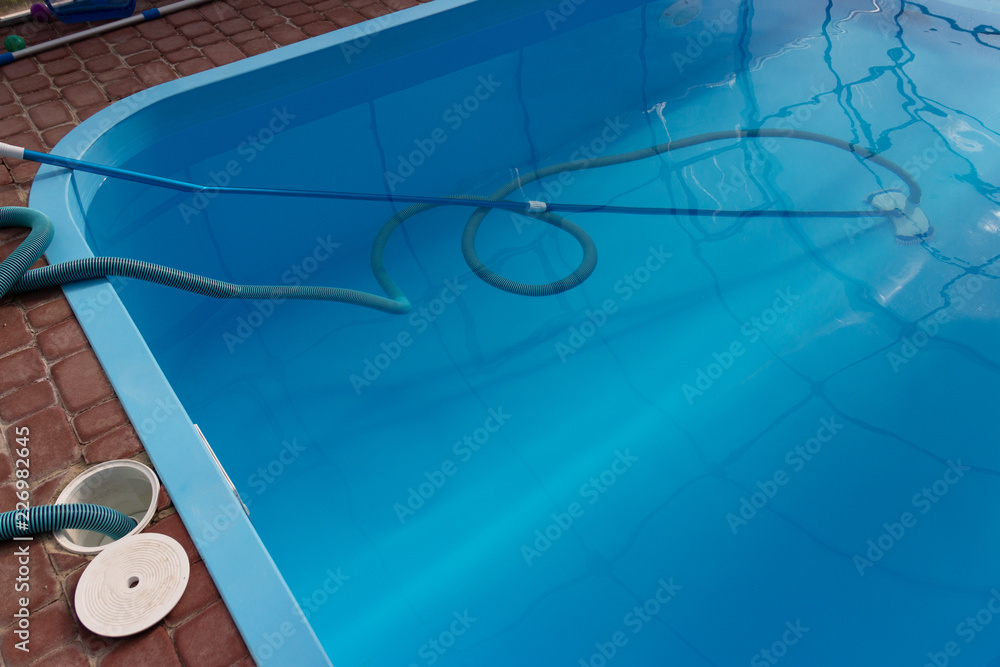 Obraz premium vacuum cleaner for the pool, clean up and care for the bottom of the pool. collect, absorb garbage and dirt. automatically takes away particles from the bottom and sides of the vacuum