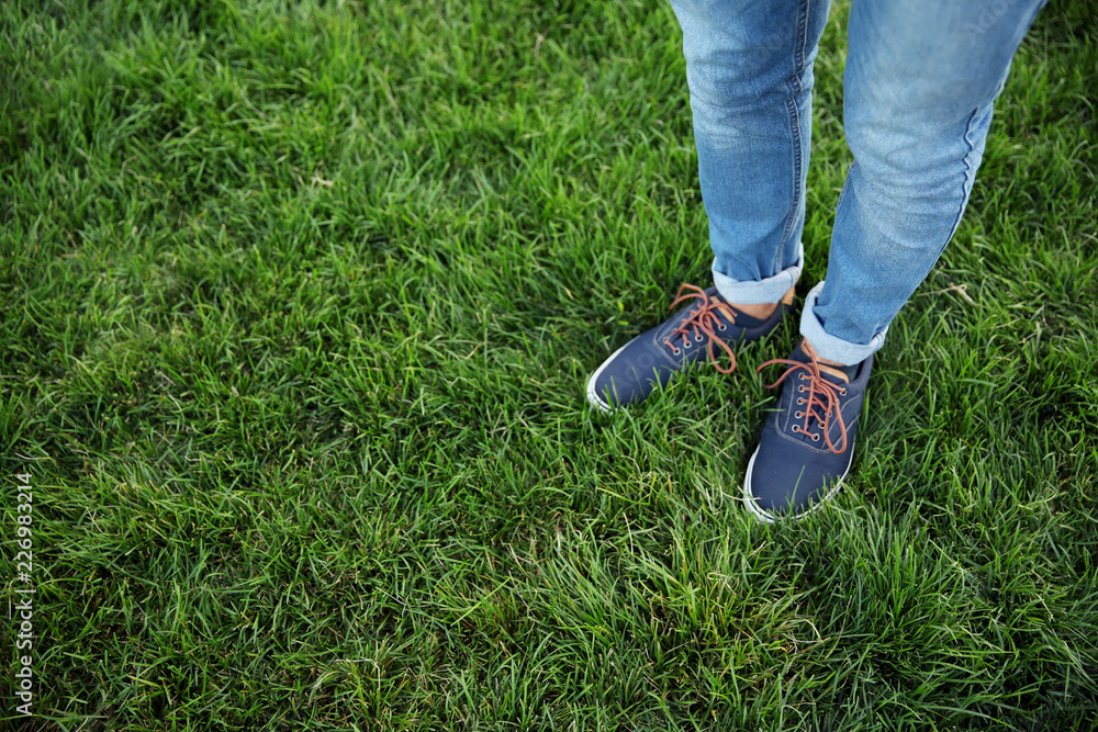Legs of young man in park Legs of young man in park
