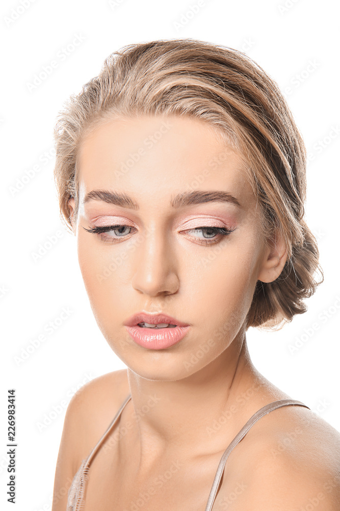 Beautiful young woman with nude makeup on white background Beautiful young woman with nude makeup on white background