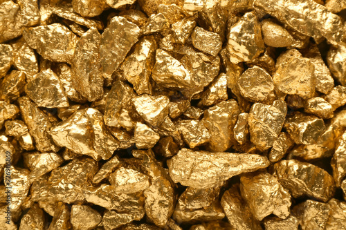 Bild auf Leinwand Many gold nuggets as background