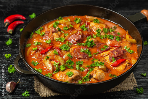 Chicken chilindron with thick vegetable sauce with red wine and dry-cured ham.  © starets