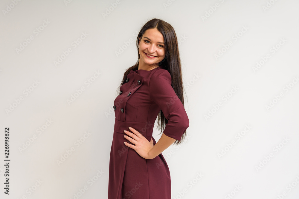 Studio portrait of a beautiful brunette girl on a white background with different emotions. Studio portrait of a beautiful brunette girl on a white background with different emotions.