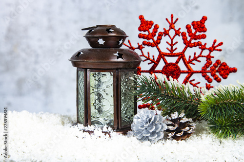 Christmas lantern, fir branch and snowflake