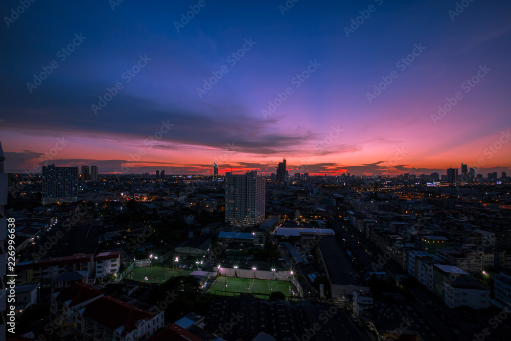 The background of the evening sky with tall buildings, colorful, constantly changing, is a natural beauty.