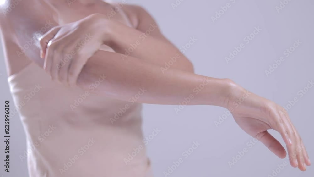 Young woman is applying lotion to the skin Young woman is applying lotion to the skin
