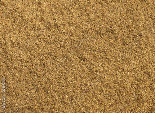 Ground cumin texture as background