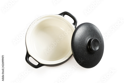 Cooking pot isolated on white. Black colour outside and white inside.