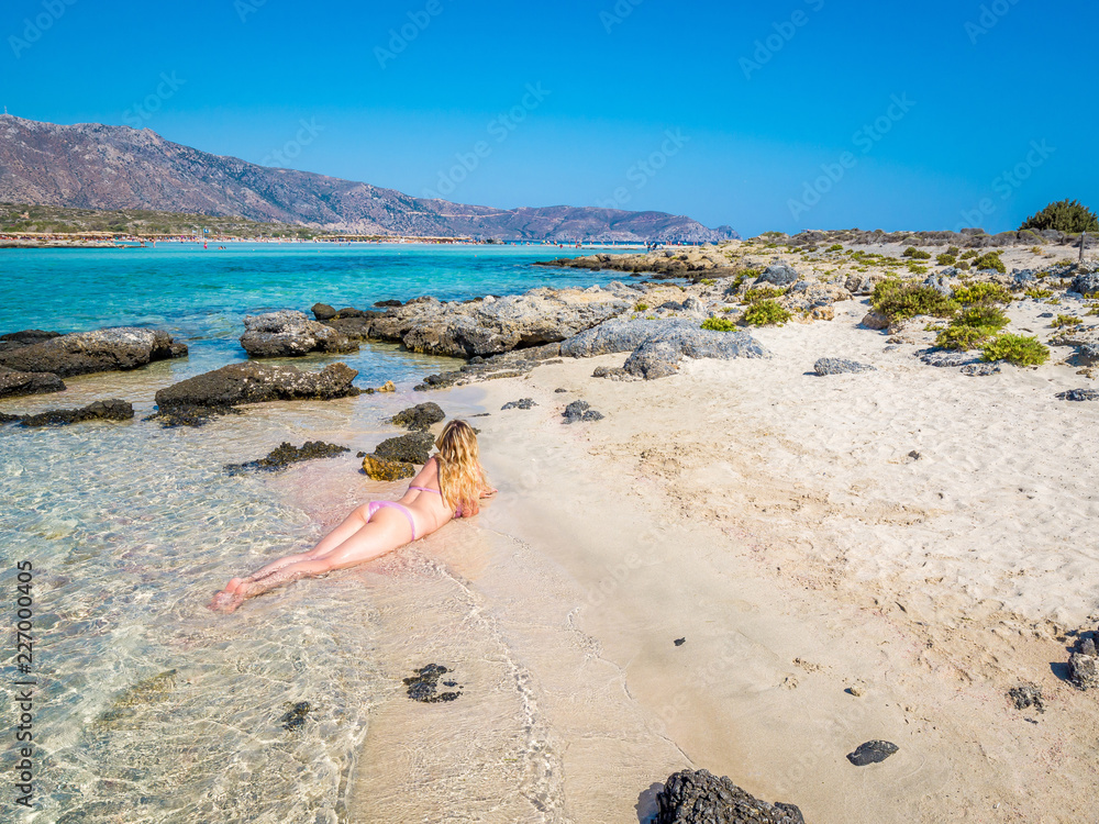 Beautiful blonde sexy curvy girl body on the paradise beach of