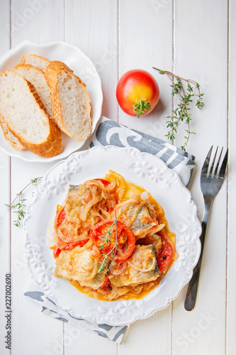 Fried fish with vegetables and sauce. Top veaw photo