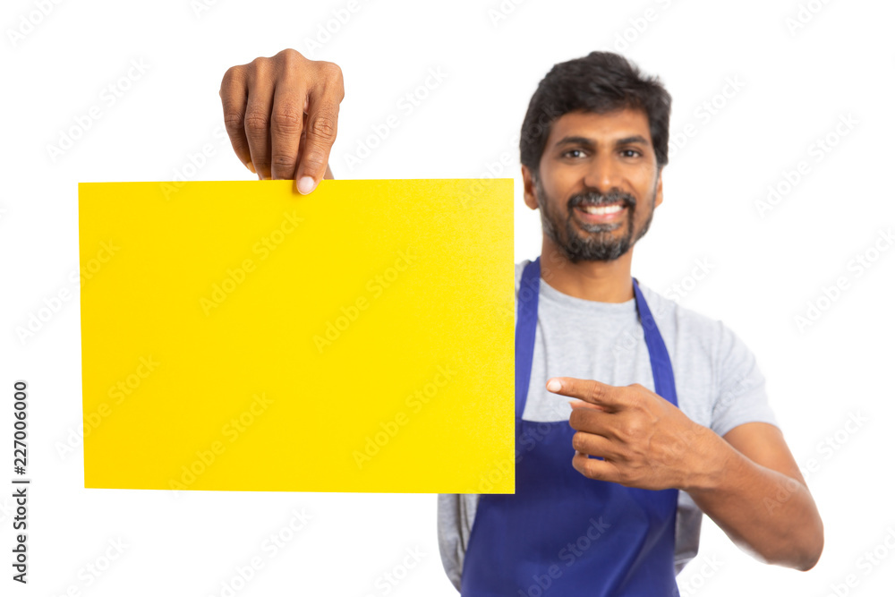 Supermarket employee presenting yellow paper. Supermarket employee presenting yellow paper.