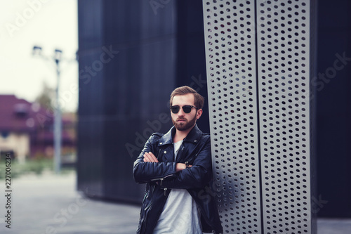 portrait of a stylish young man in leather jacket