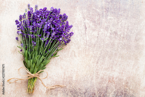 Fototapeta Naklejka Na Ścianę i Meble -  Lavender flowers, bouquet on rustic background, overhead.