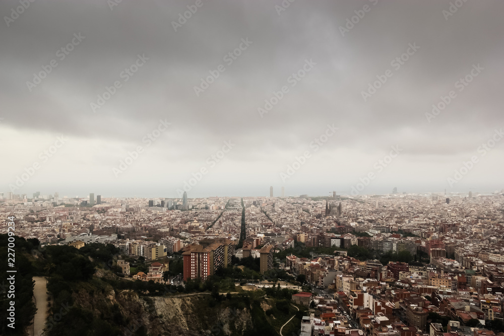 Cloudy view on Barcelona city from the mountain