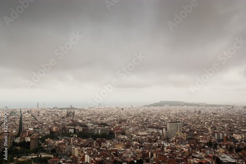 Cloudy view on Barcelona city from the mountain