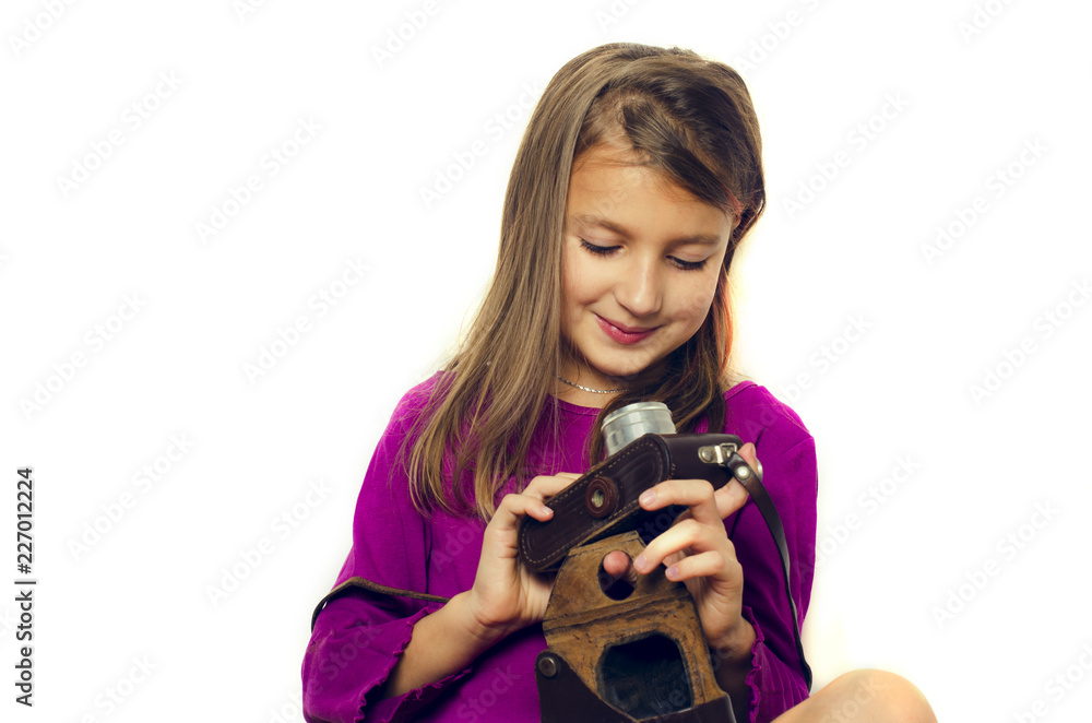 cute girl smiles and holds old film camera in hands on white background cute girl smiles and holds old film camera in hands on white background