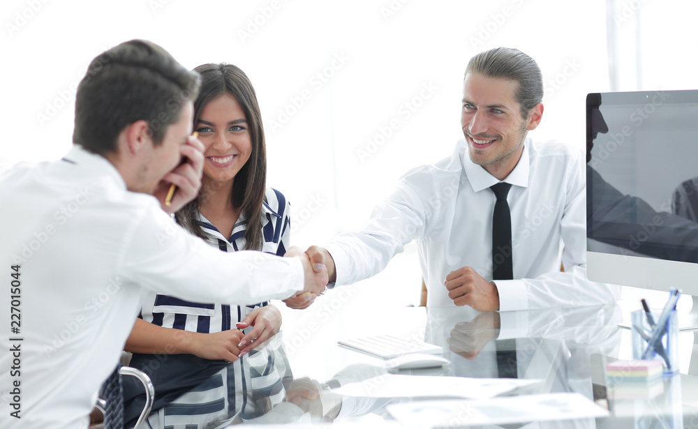 Business people shaking hands, finishing up a meeting Business people shaking hands, finishing up a meeting