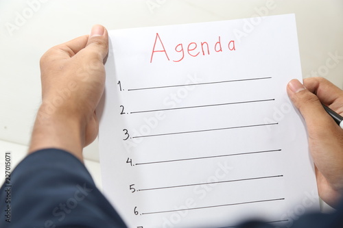 hand holding business agenda list