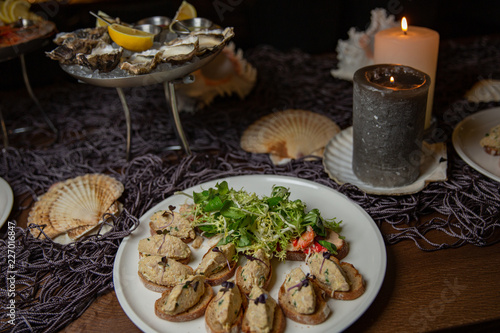 duck liver patee, dried plums, bruschetta. nautical theme photo