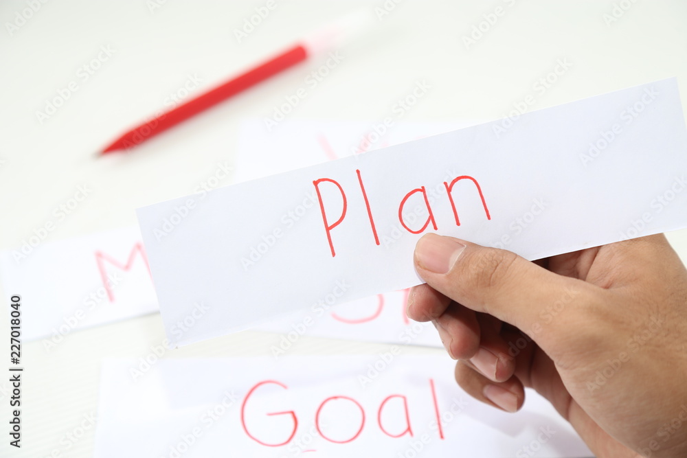 business hand holding a piece of plan paper business hand holding a piece of plan paper