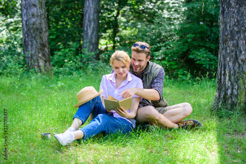 Couple in love spend leisure reading book. Couple soulmates at romantic date. Romantic couple students enjoy leisure with poetry nature background. Pleasant weekend. Romantic date at green meadow © be free