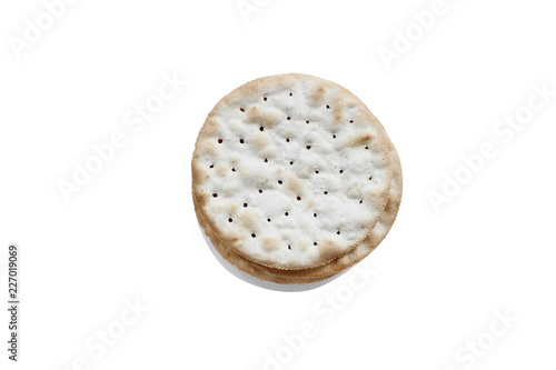 Isolated water crackers with light shadow over a white background. Clipping path included. Image shot from overhead.