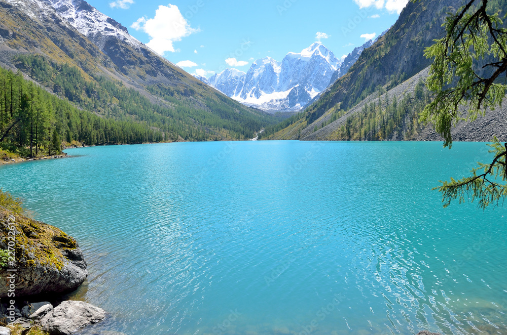 The mountains Skazka and Krasavitsa (Tale and Beautiful) in a Large Shavlinskoye lake, Altai mountains, Russia The mountains Skazka and Krasavitsa (Tale and Beautiful) in a Large Shavlinskoye lake, Altai mountains, Russia