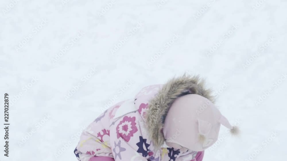 Smiling little rgirl playing with Snow Smiling little rgirl playing with Snow