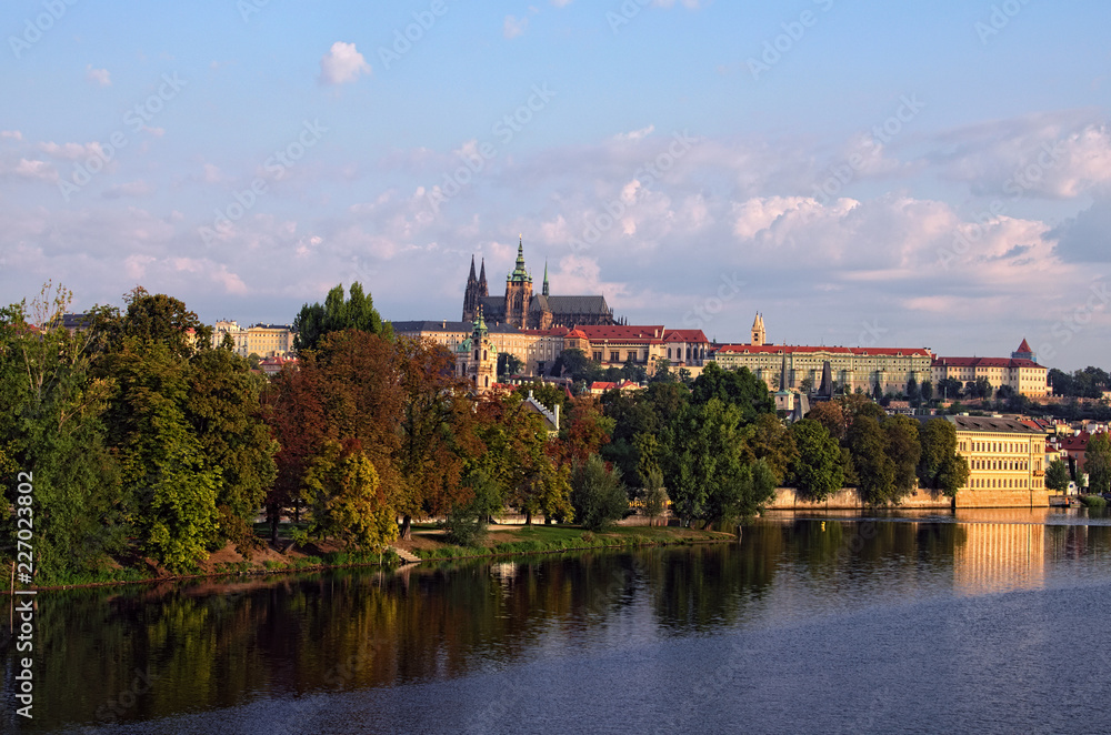 Picturesque view of the historical part of the city Prague in morning. Medieval Charles Bridge over Vltava River and Strelecky Island. Prague Castle with Saint Vitus Cathedral at the background
