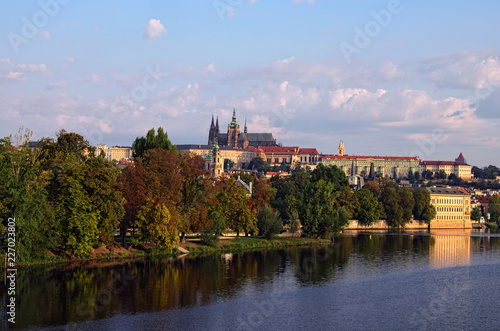 Picturesque view of the historical part of the city Prague in morning. Medieval Charles Bridge over Vltava River and Strelecky Island. Prague Castle with Saint Vitus Cathedral at the background