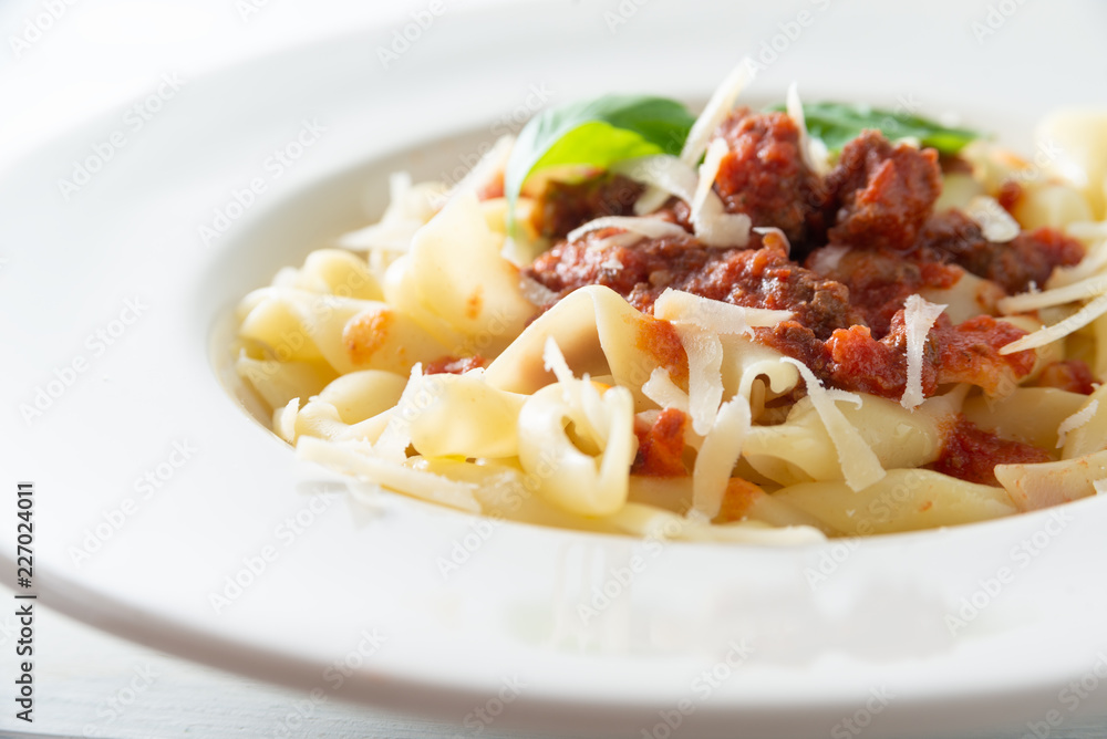 Piatto di pasta con ragu di cinghiale e pecorino, Italian food Piatto di pasta con ragu di cinghiale e pecorino, Italian food