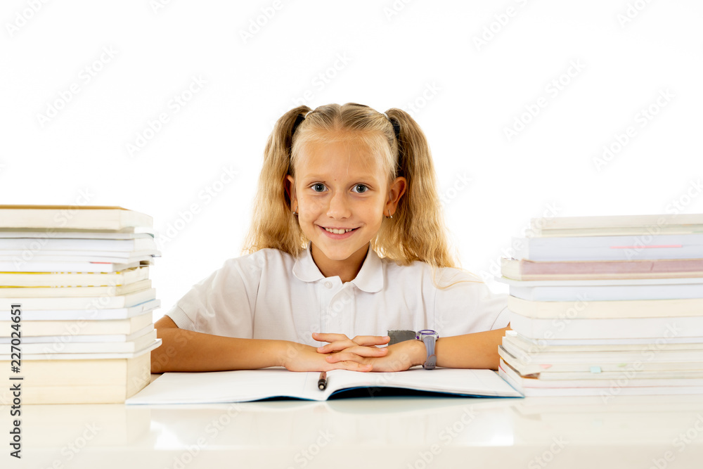 Cute smiling little girl with a pile of books feeling happy Cute smiling little girl with a pile of books feeling happy
