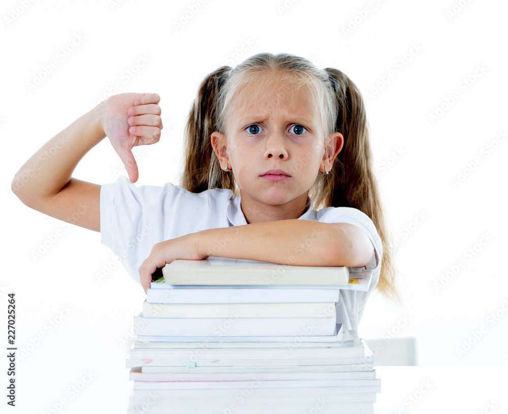 Stressed schoolgirl overwhelmed with too much homework hatting studying and school Stressed schoolgirl overwhelmed with too much homework hatting studying and school