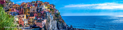 Panoramic view of colorful cityscape on the mountains over Mediterranean sea, Cinque Terre, Italy photo