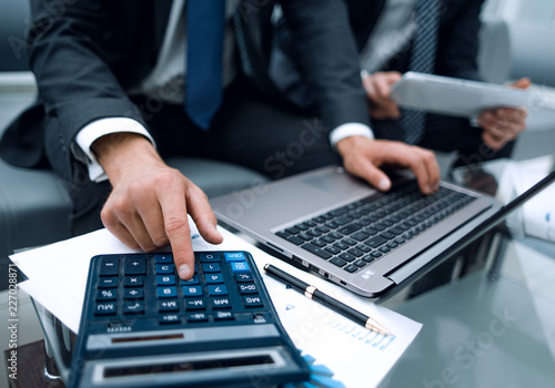 close up.businessman using a calculator for calculating financial profit. © ASDF