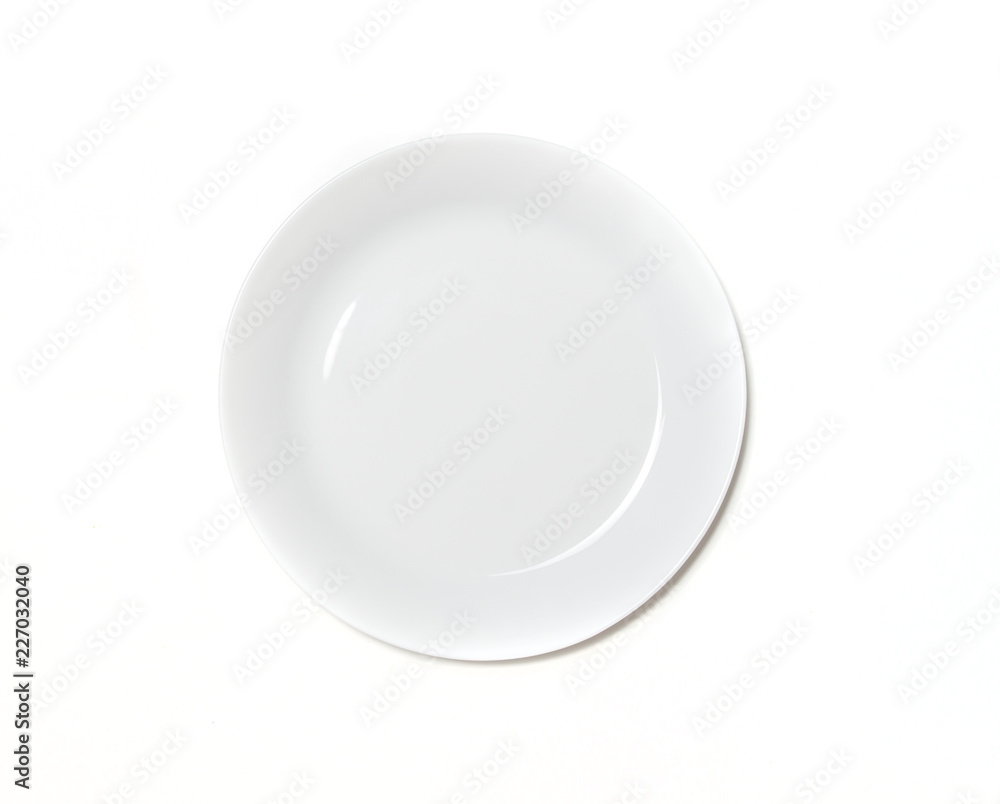 Empty ceramic round plate isolated on white. Isolated white plate top view Empty ceramic round plate isolated on white. Isolated white plate top view