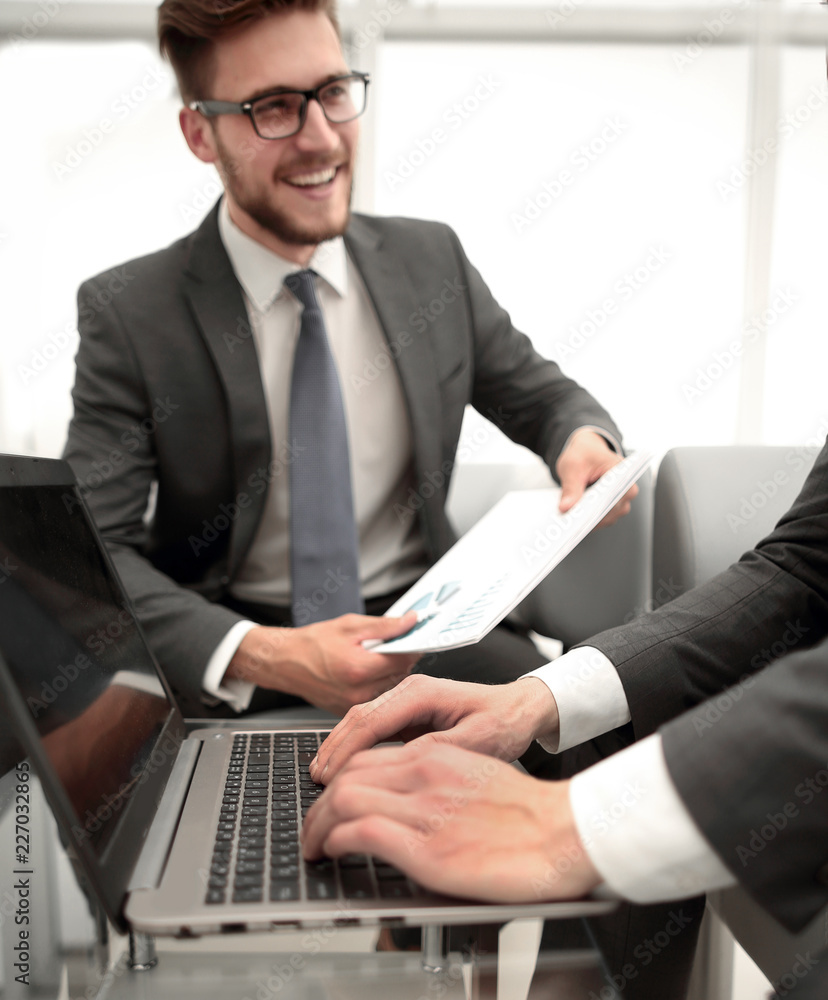 close up.smiling businessman with financial documents close up.smiling businessman with financial documents