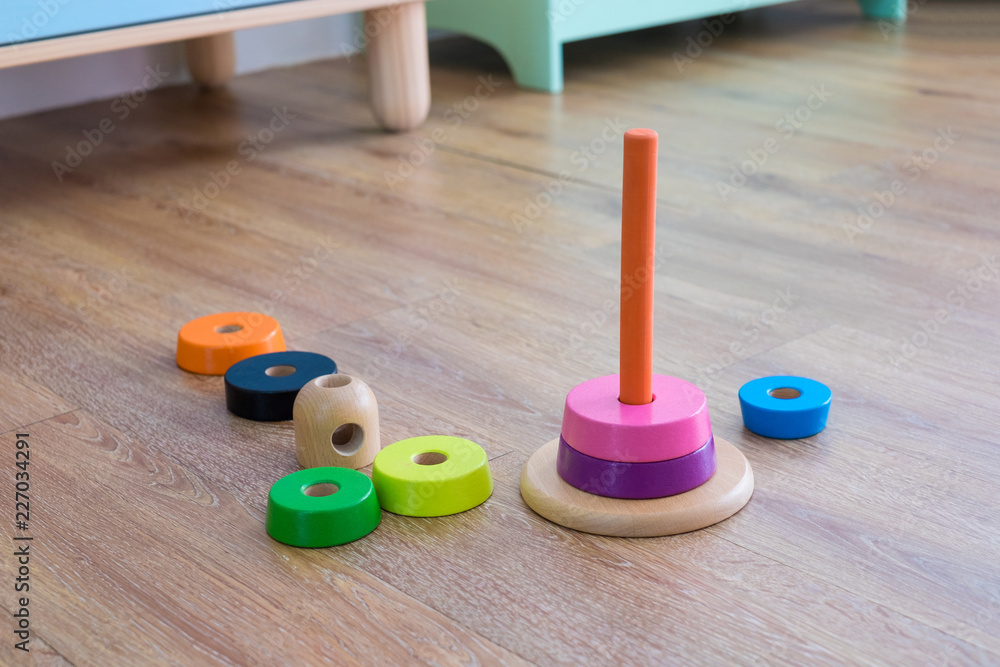 Colorful wooden toy stacking rings