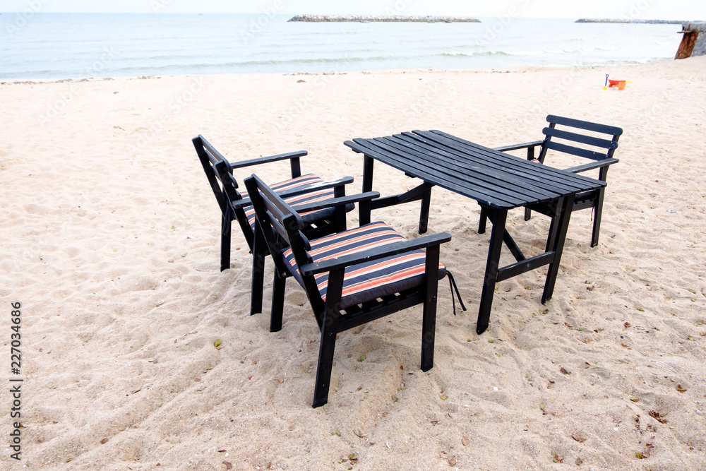 Dining table and chairs on the beach Dining table and chairs on the beach