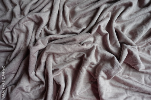 Rumpled simple grey viscose fabric from above