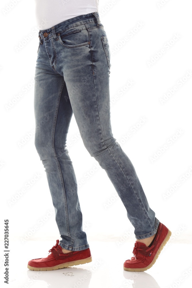 Man legs with blue denim, studio shot Man legs with blue denim, studio shot