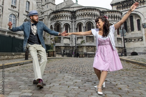 Photography A couple of lovers dressed retro style dancing  in the streets of Montmartre, Pa