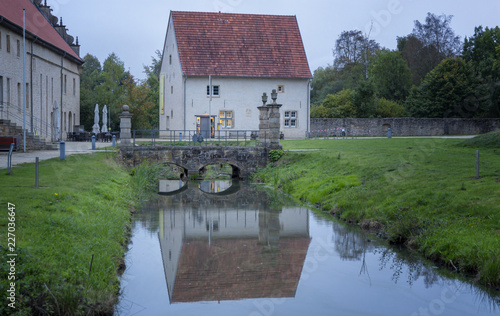Wasserspiegelung eines Gebäudes von Kloster Gravenhorst photo