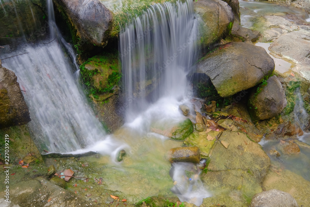 Continuous water flowing in the river of Ulu Bendul, Malaysia Continuous water flowing in the river of Ulu Bendul, Malaysia