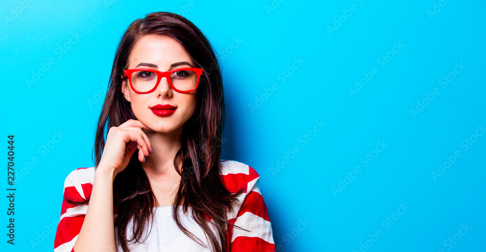 portrait of the beautiful young woman on the blue background portrait of the beautiful young woman on the blue background